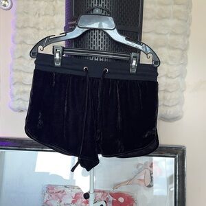 Forever 21 velvet polyester shorts with the word loyal in the back in rhinstones